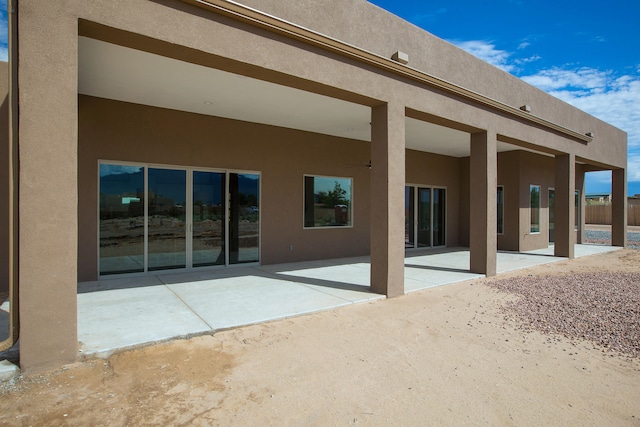 back of property with a patio area