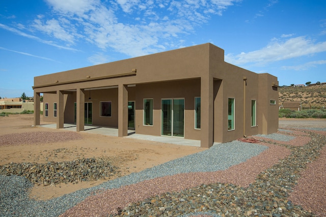 rear view of property featuring a patio