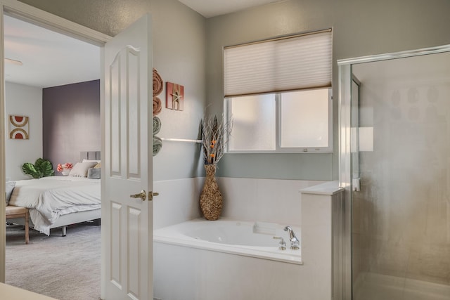 bathroom featuring separate shower and tub