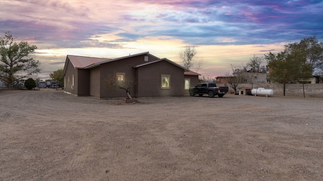 view of property exterior at dusk