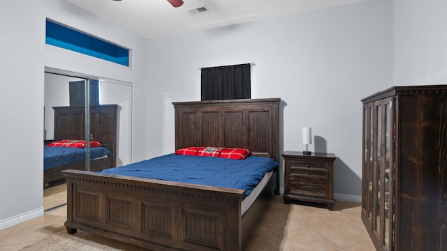 tiled bedroom with ceiling fan