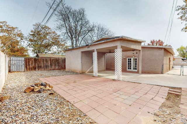 rear view of property with french doors and a patio area