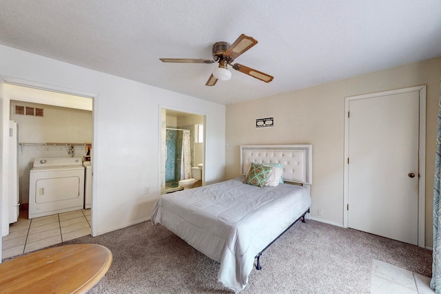 carpeted bedroom with ensuite bathroom, ceiling fan, a textured ceiling, and independent washer and dryer