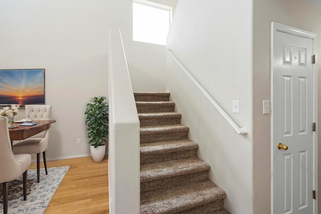 staircase featuring hardwood / wood-style flooring