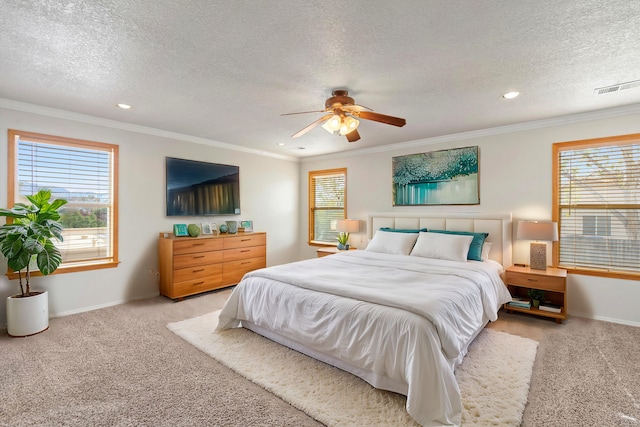 bedroom with light carpet, a textured ceiling, ceiling fan, and crown molding