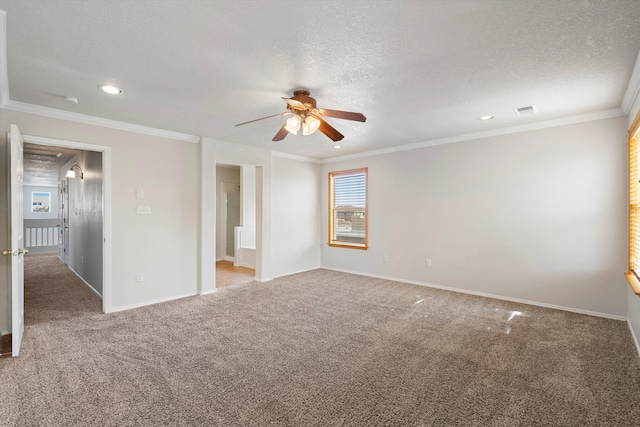 unfurnished room featuring ceiling fan, crown molding, carpet floors, and a textured ceiling