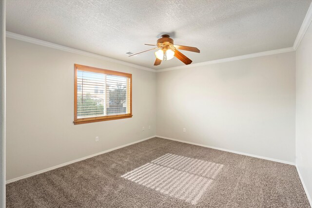 empty room featuring carpet flooring, ornamental molding, and a textured ceiling