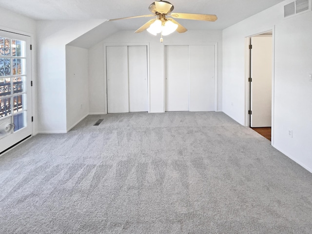 bonus room with carpet flooring, ceiling fan, and vaulted ceiling