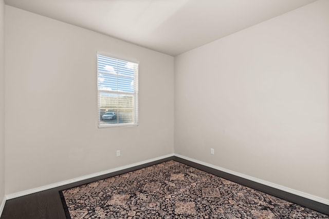 empty room featuring wood-type flooring