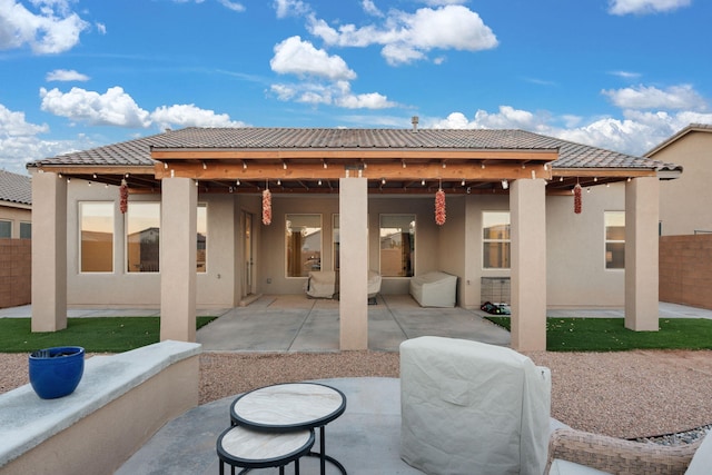 back of house with a patio