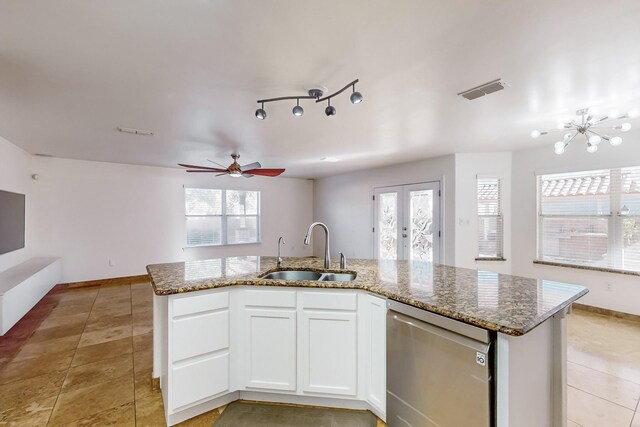 kitchen with white cabinetry, sink, stainless steel dishwasher, and a kitchen island with sink