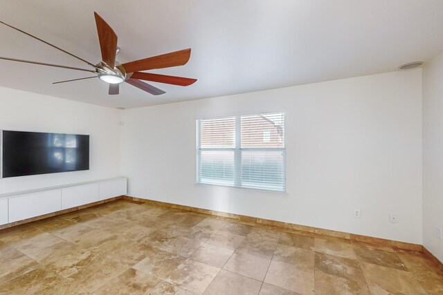 unfurnished living room featuring french doors, ceiling fan, and sink