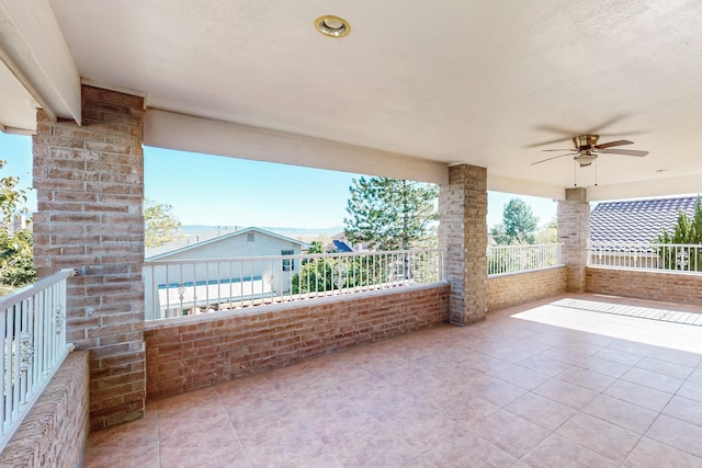 view of patio / terrace featuring a balcony and ceiling fan