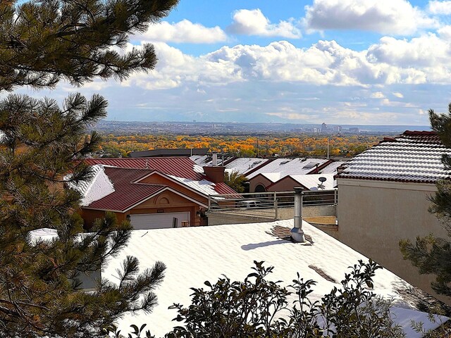 view of patio with ceiling fan and a balcony