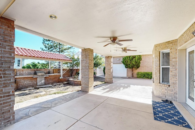 view of patio / terrace with area for grilling and ceiling fan