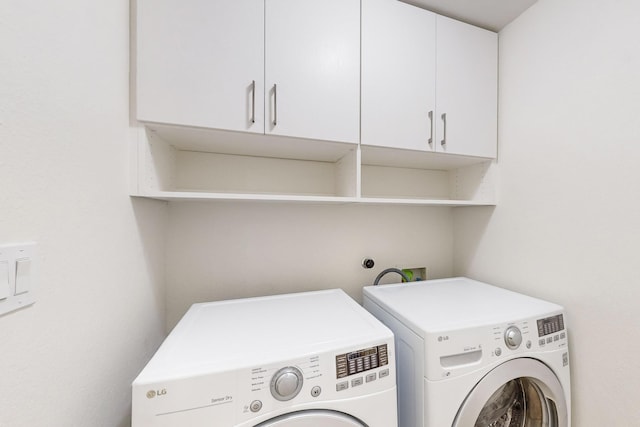 laundry room with cabinets and independent washer and dryer