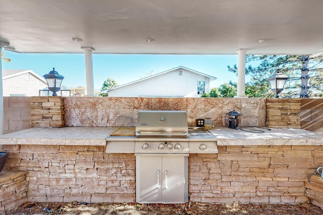 view of patio featuring grilling area and an outdoor kitchen