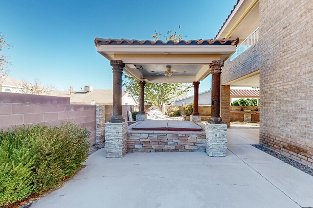 rear view of house featuring french doors, a balcony, and a patio area