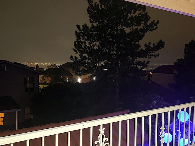 yard at night with a balcony