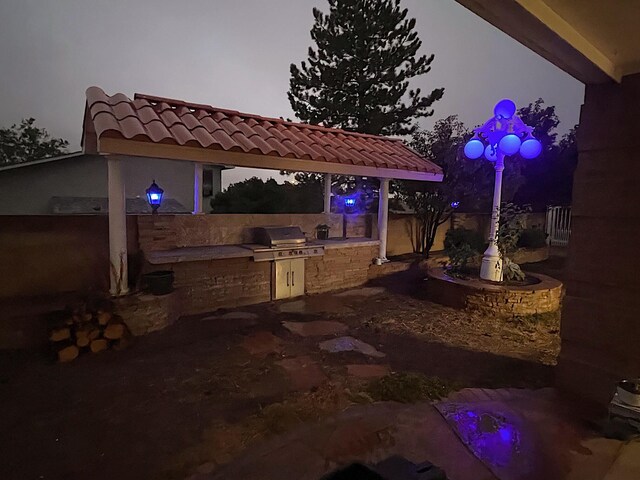 view of patio with cooling unit, ceiling fan, and a bar