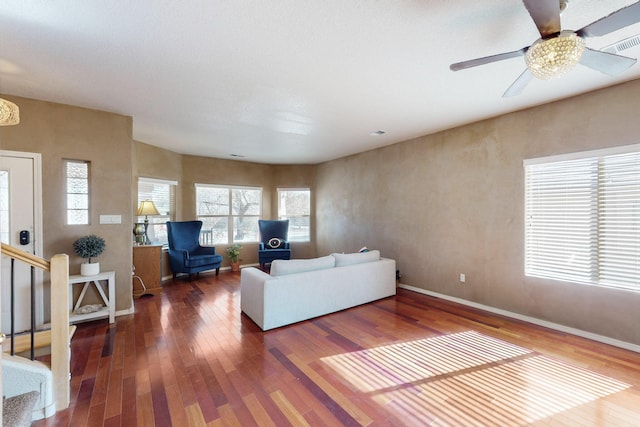 living room with wood-type flooring and ceiling fan