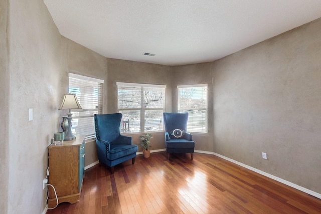 sitting room featuring hardwood / wood-style flooring