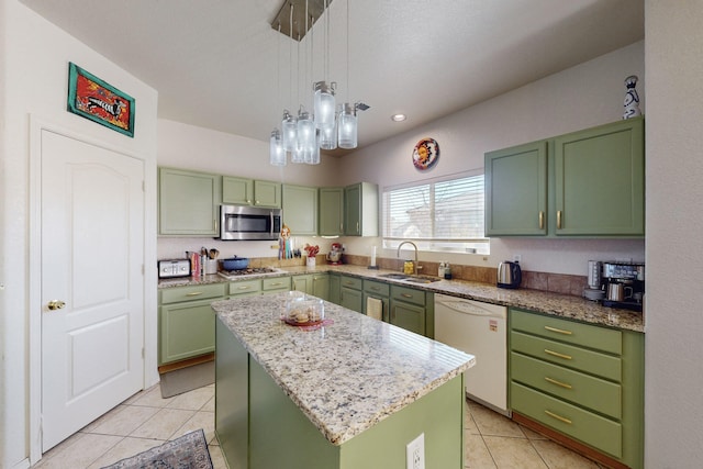 kitchen featuring a kitchen island, sink, green cabinets, and appliances with stainless steel finishes