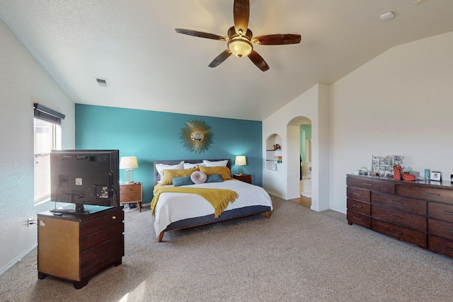 bedroom featuring ceiling fan, light colored carpet, and vaulted ceiling