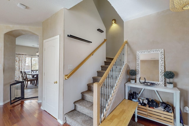 stairway with hardwood / wood-style flooring