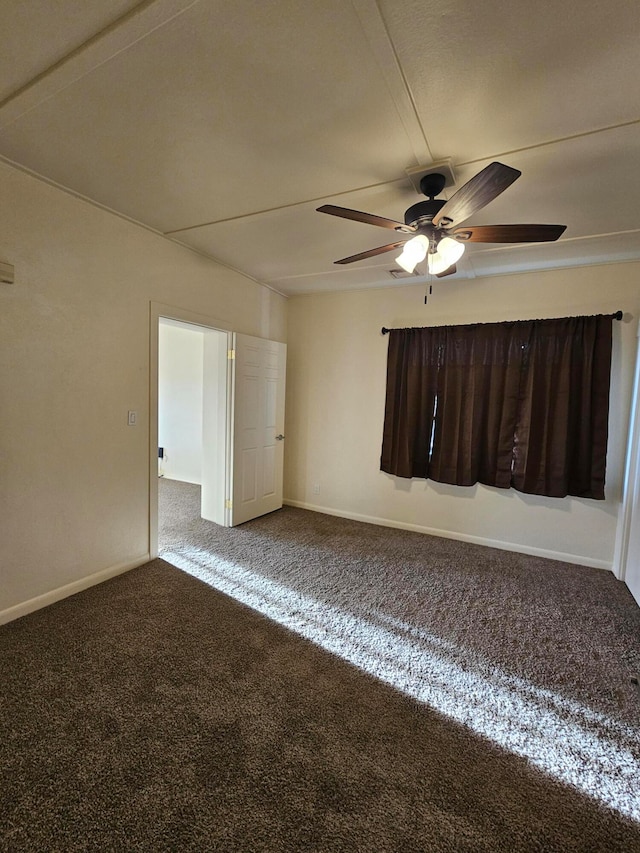 spare room featuring carpet and ceiling fan