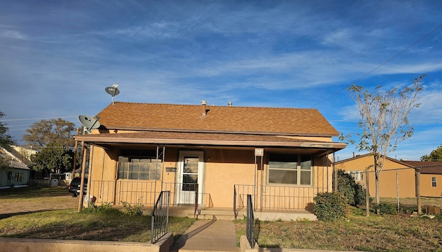 bungalow with a front yard