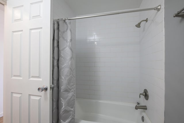 full bathroom with shower / bath combo with shower curtain