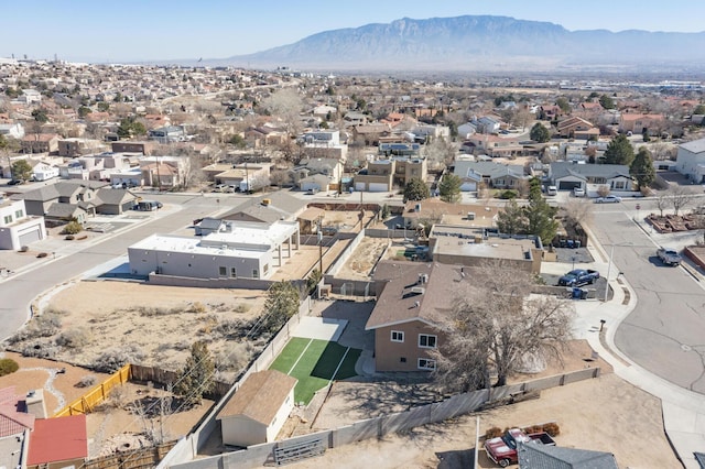 birds eye view of property with a residential view and a mountain view