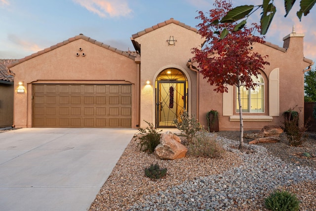 view of front of home with a garage