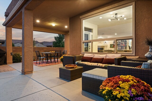 patio terrace at dusk with an outdoor living space