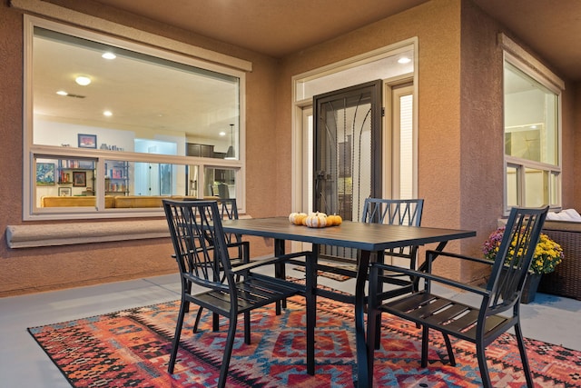 dining space with concrete flooring