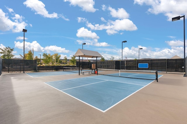 view of sport court with basketball hoop