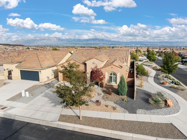 birds eye view of property with a mountain view