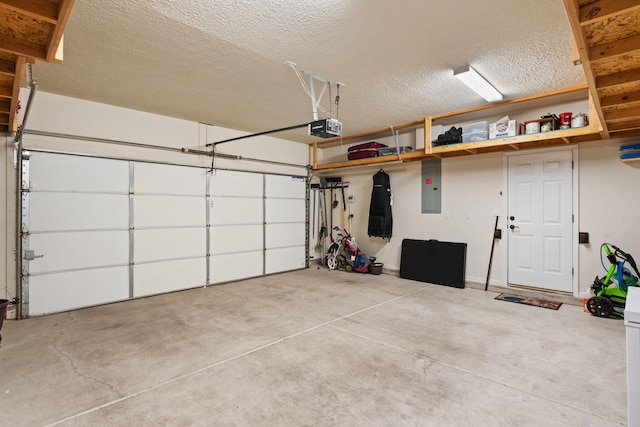 garage featuring electric panel and a garage door opener