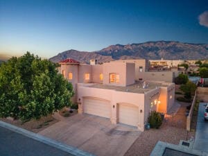 view of front of home featuring a mountain view and a garage