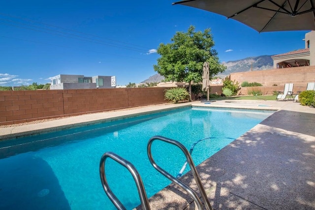 view of swimming pool featuring a mountain view