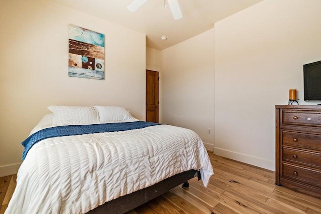 bedroom featuring light hardwood / wood-style flooring and ceiling fan