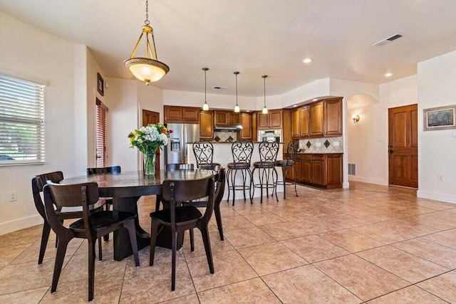 dining room with light tile patterned flooring