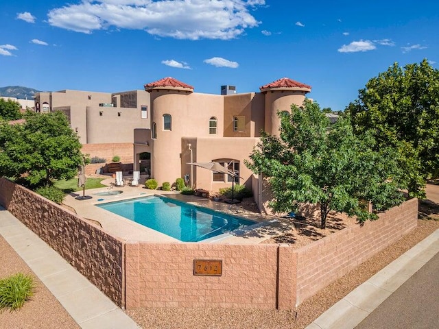 view of swimming pool featuring a patio area