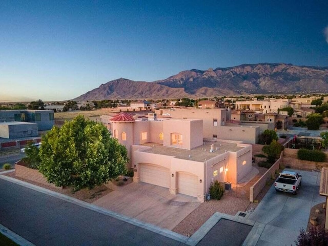 exterior space with a mountain view and a garage