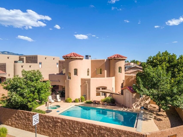 view of pool featuring a hot tub