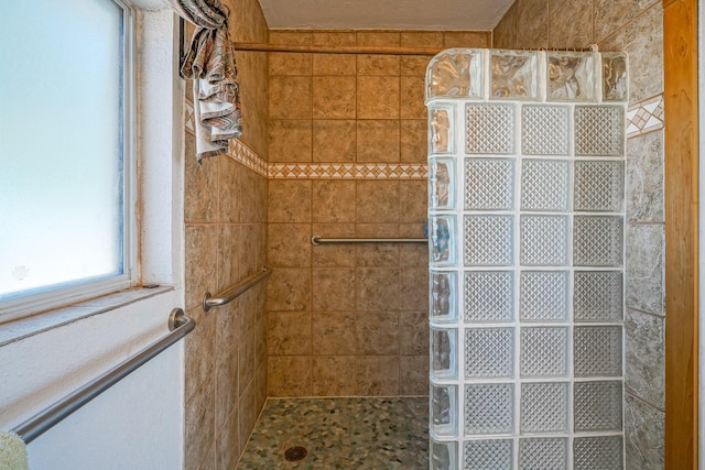 bathroom featuring tiled shower