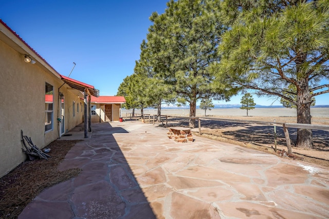 view of patio featuring a water view