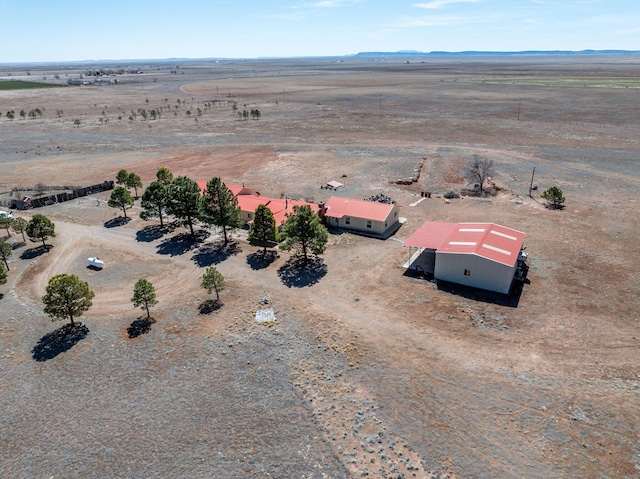 birds eye view of property with a rural view