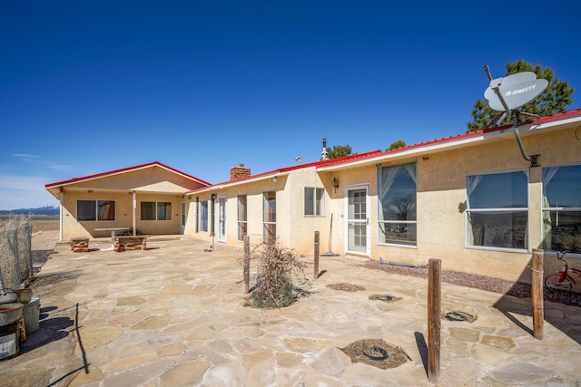 rear view of house featuring a patio area